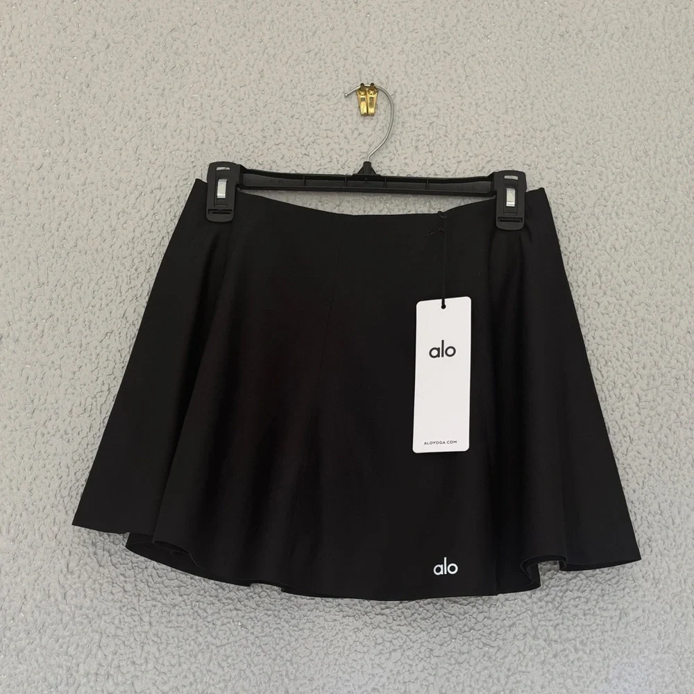 ALO Yoga Airlight Down The Line Black Mini Tennis Skirt with shorts underneath